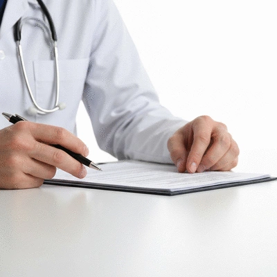 Medical records being reviewed by a health professional